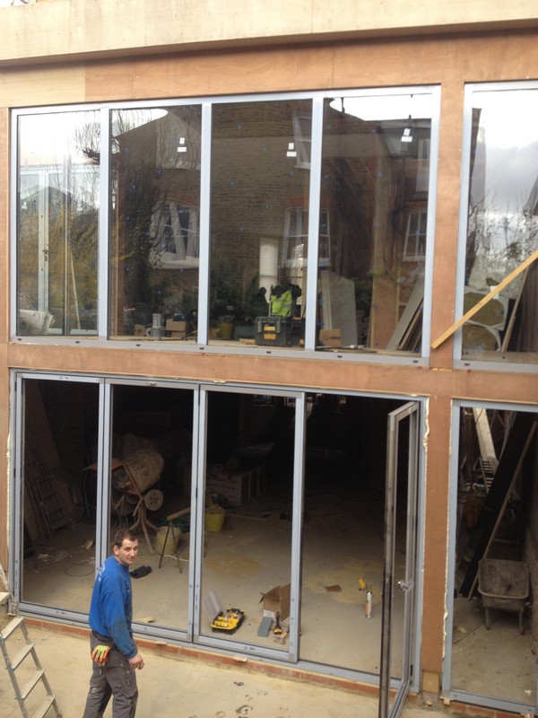 Aluminium bi-fold doors with two-storey glazing in Highbury